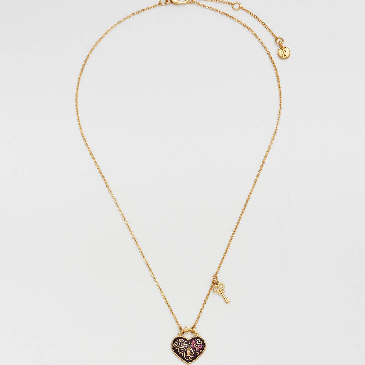 Collier Fable England Eve, pendentif cœur cadenas bordeaux et clé, plaqué or 22 carats