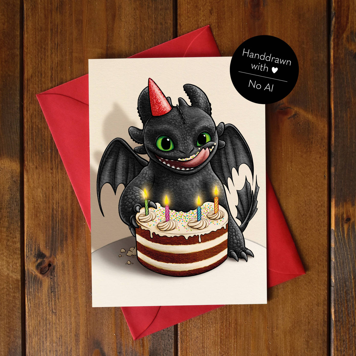 Carte d'anniversaire illustrée d'un petit dragon à chapeau de fête devant un gâteau coloré