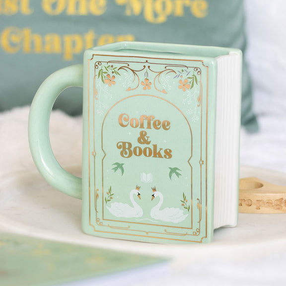 Mug en céramique en forme de livre vert pastel Coffee & Books avec motifs floraux et cygnes dorés