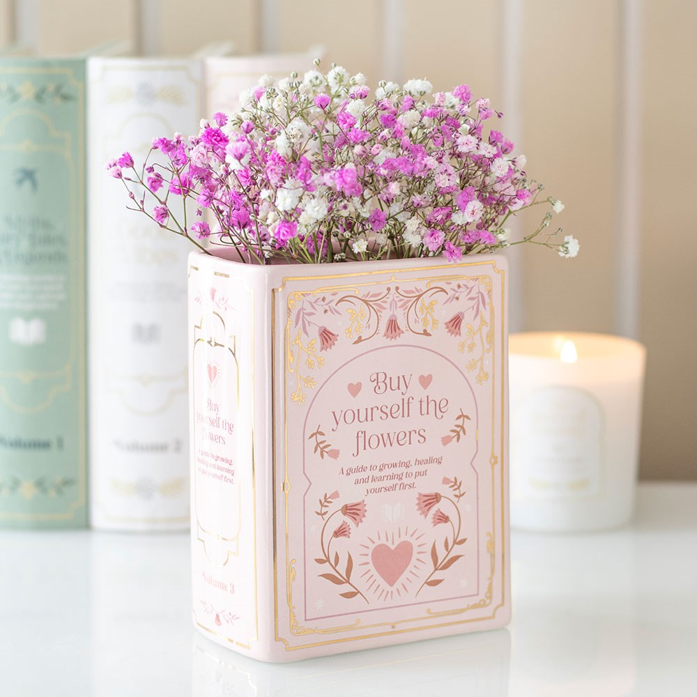 Vase en céramique en forme de livre rose avec inscription dorée Buy Yourself the Flowers
