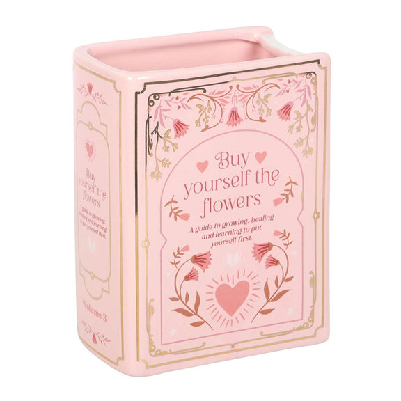 Vase en céramique en forme de livre rose avec inscription dorée Buy Yourself the Flowers
