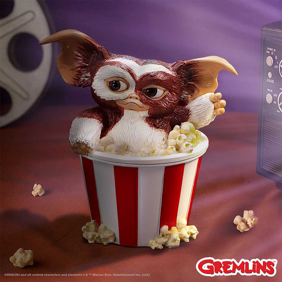 Boîte de collection Gremlins avec Gizmo surgissant d'un pot de popcorn rayé rouge et blanc