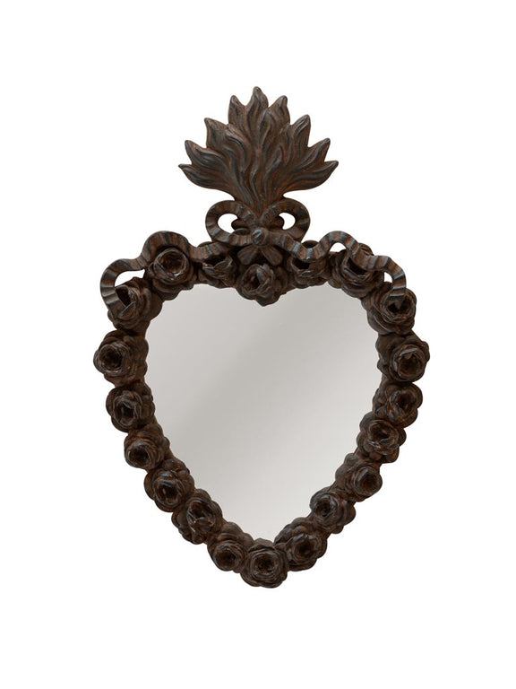 Miroir ex-voto en forme de cœur à patine foncée, entouré de roses en relief et flamme