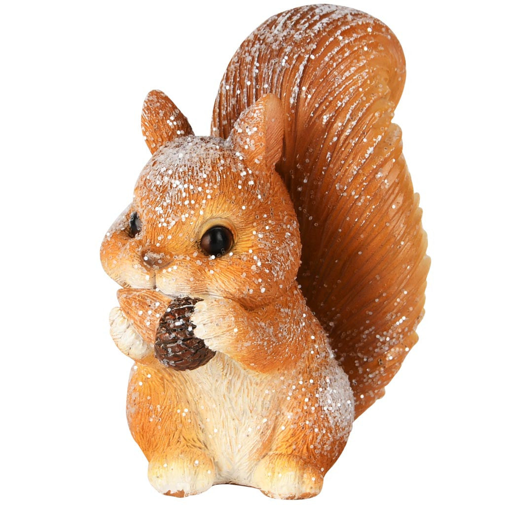 Figurine écureuil pailleté tenant une petite pomme de pin entre ses pattes
