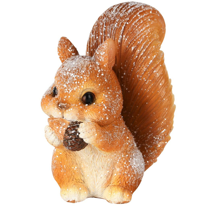 Figurine écureuil pailleté tenant une petite pomme de pin entre ses pattes